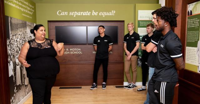 Leah Brown leads a tour of the museum