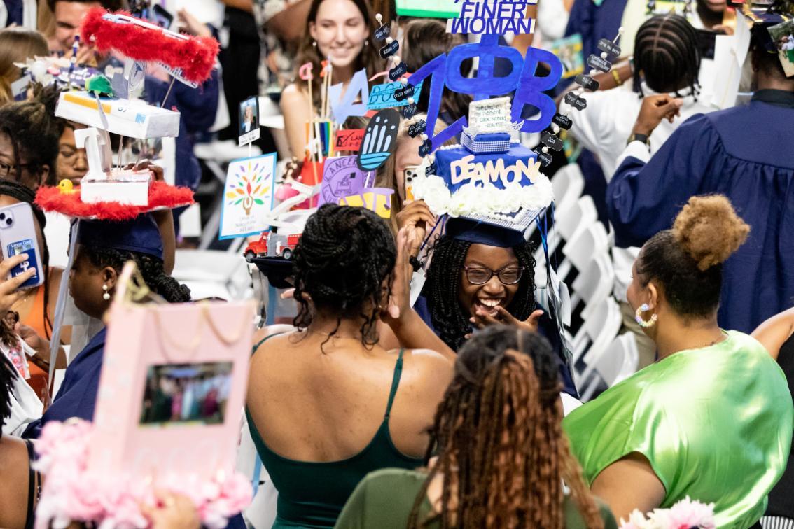 Students being capped at Convocation in the Joan Perry Brock Center