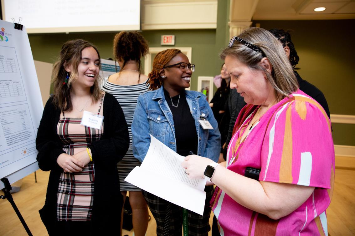 Dr. Melissa Rhoten with students during Research Day